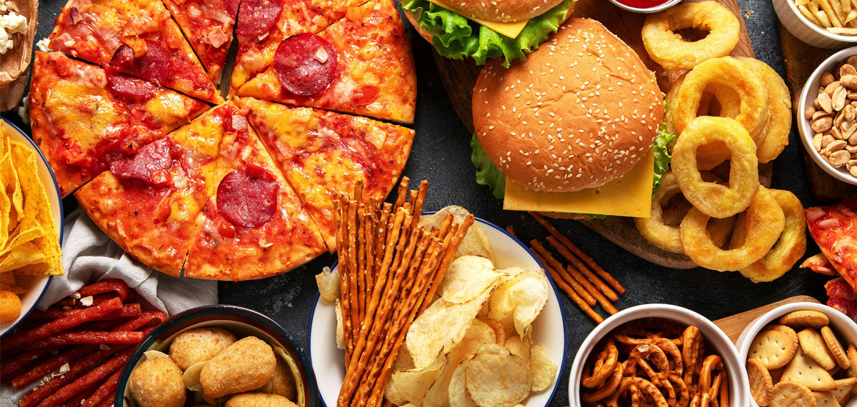 Image of Deli foods including pizza, burgers and onion rings